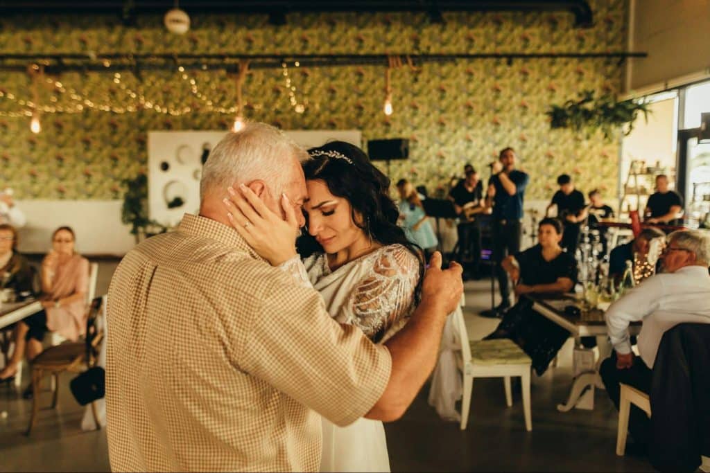 A father dancing with his daughter