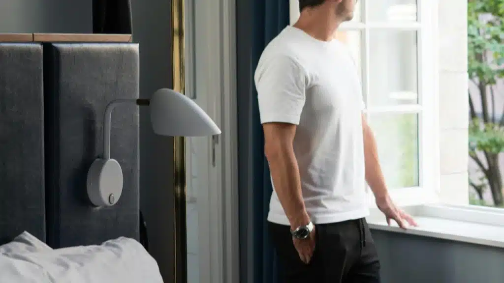A man looking out a window.
