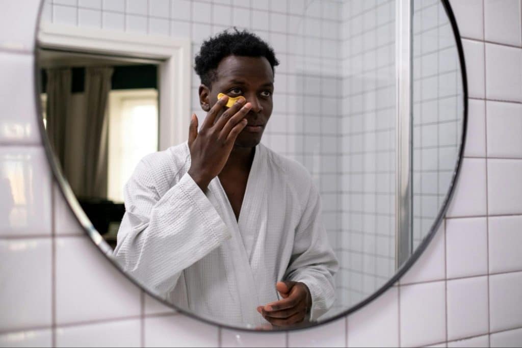 A man looking at the mirror