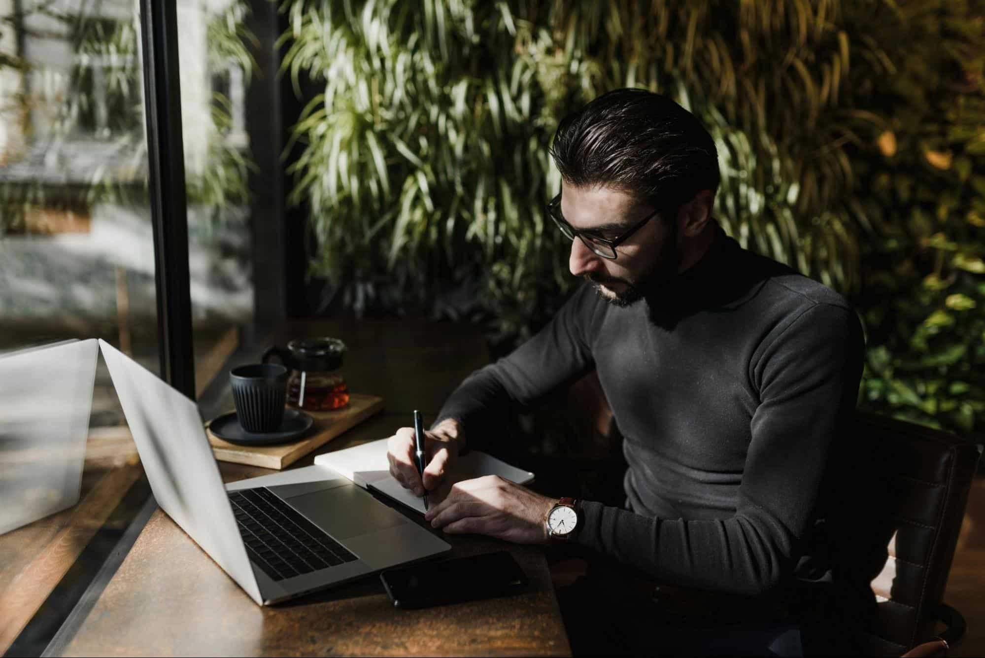 A man looking at the laptop