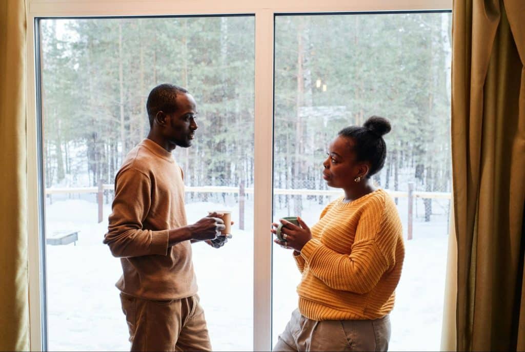 A man and woman facing each other