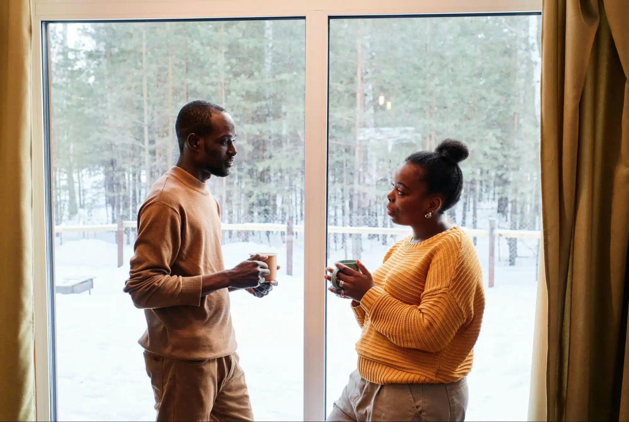 A man and woman facing each other