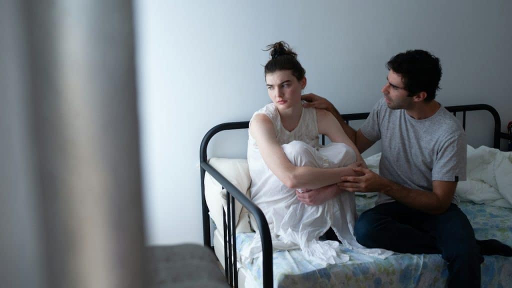 A man trying to talk to her angry wife.