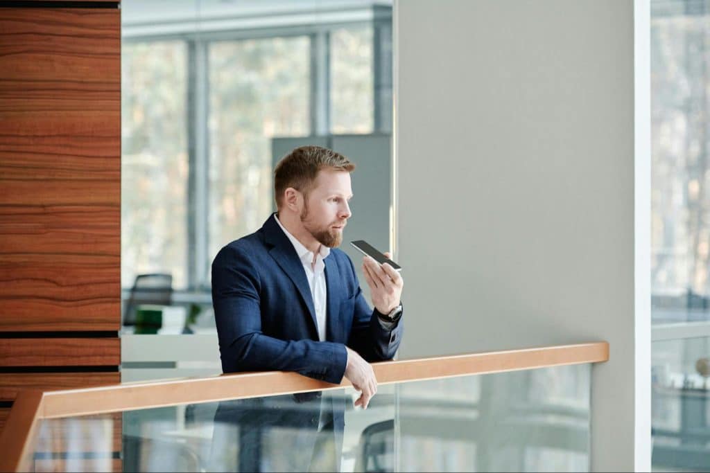 A man talking with his friend through phone