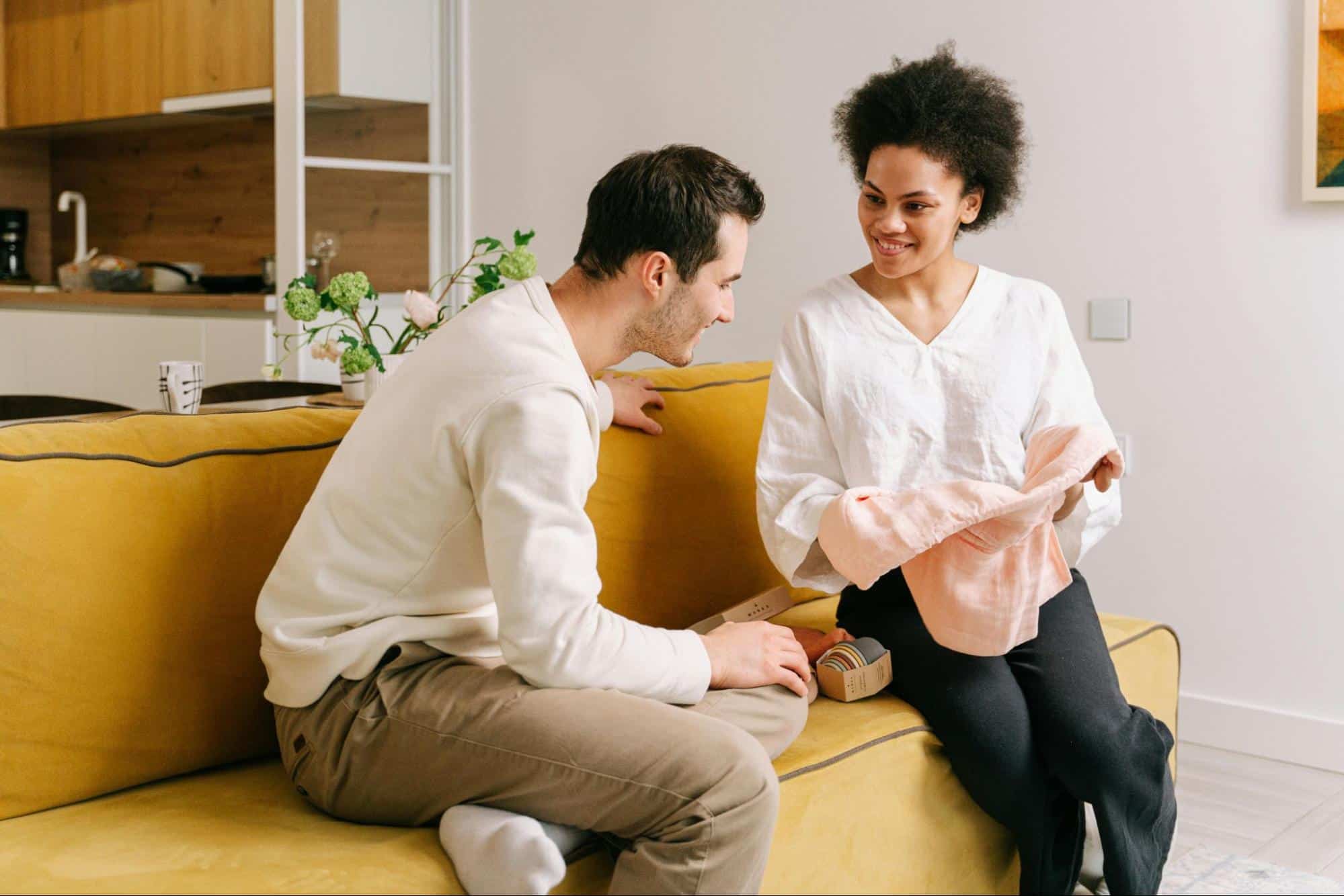 A man and woman at the couch