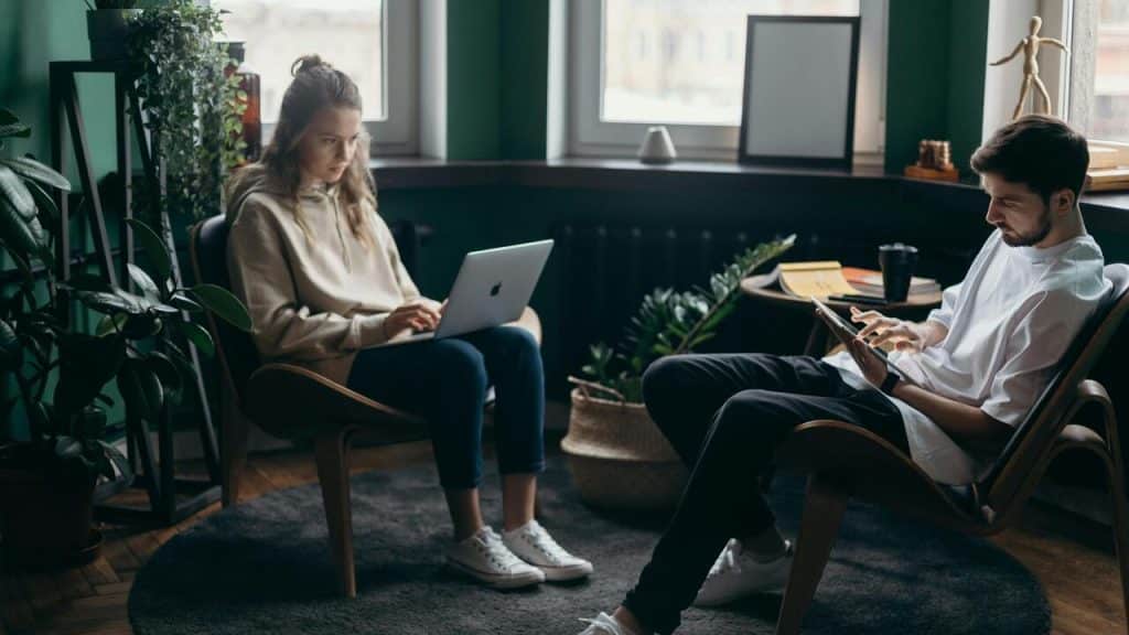 A couple using their gadgets