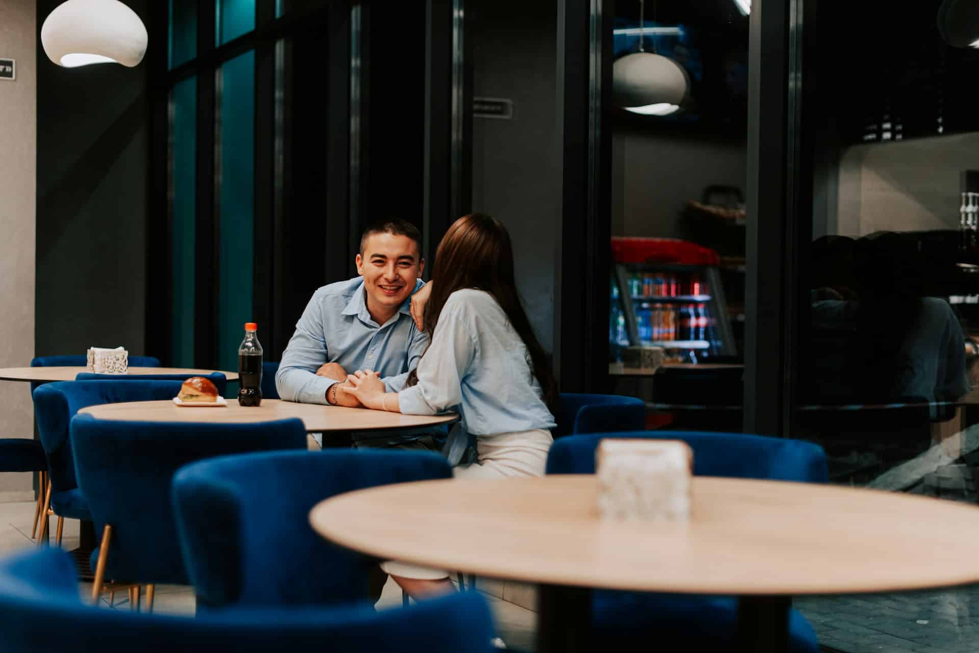 A man spending time with a woman in a restaurant.