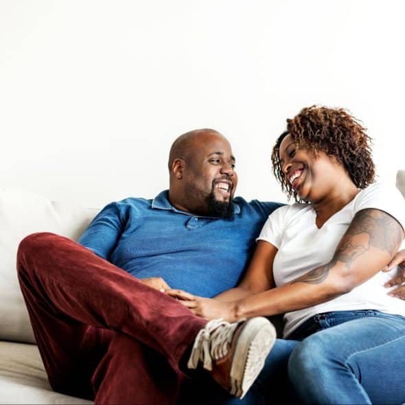 A man and woman at the couch