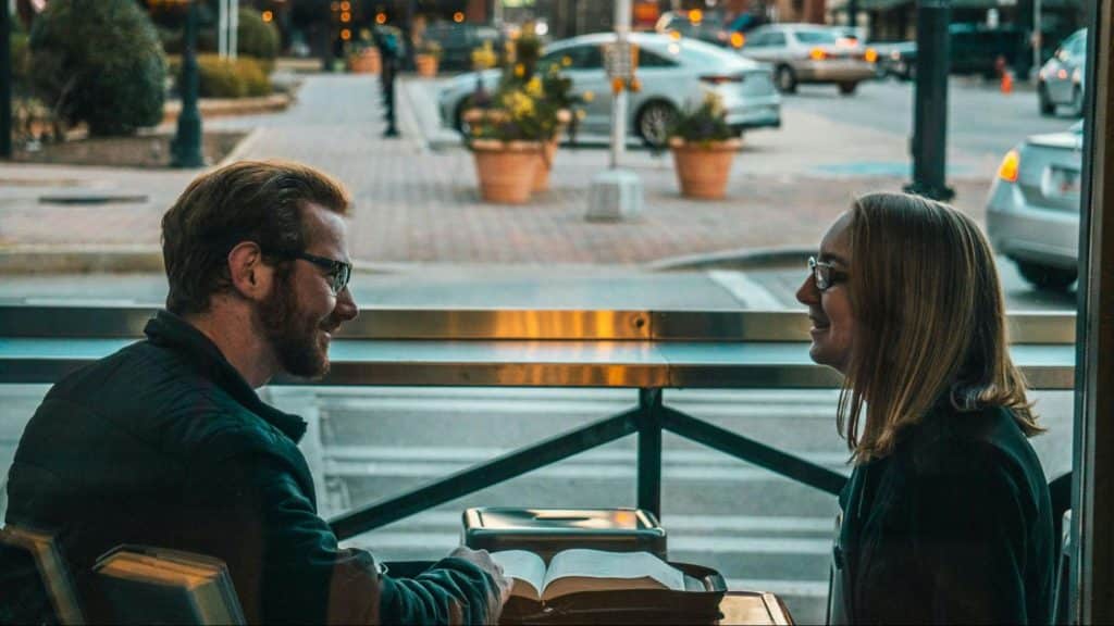 A man and woman smiling at each other