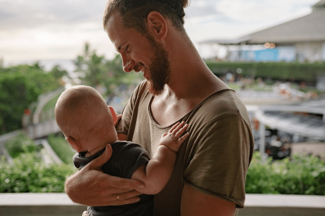 A man carrying a child