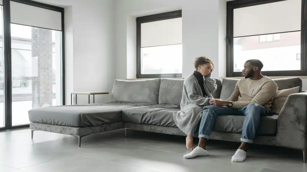 A couple talking in the living room