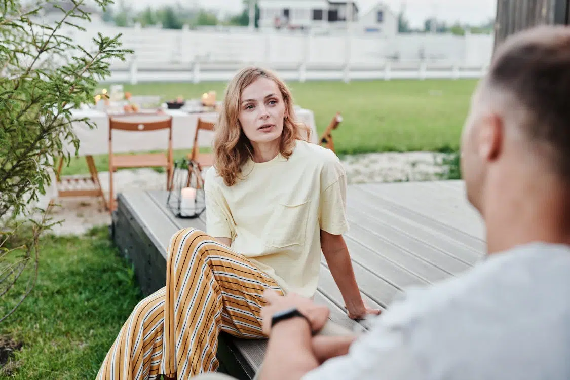 A couple talking on the patio