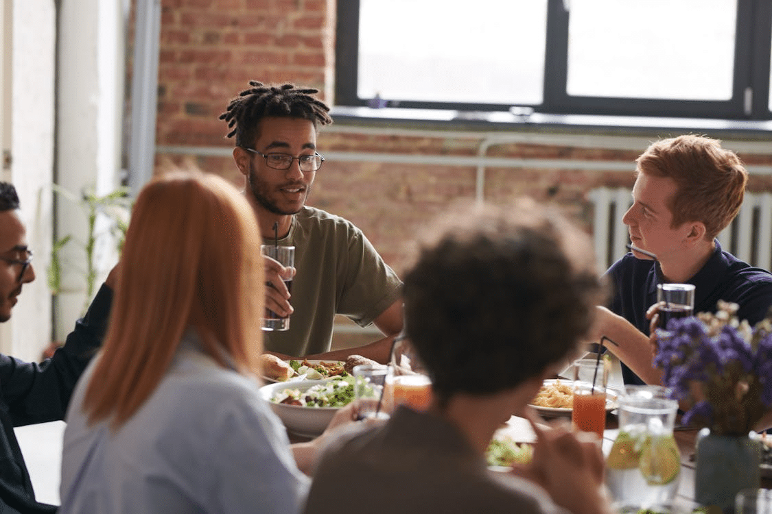 A group of people eating together