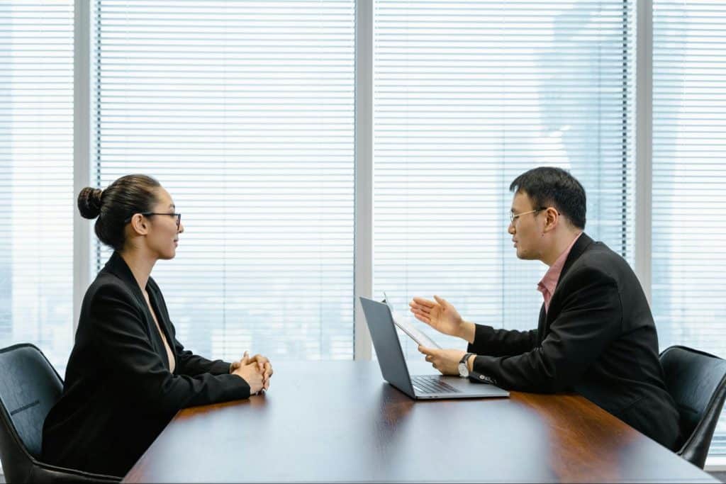 A man and woman facing each other