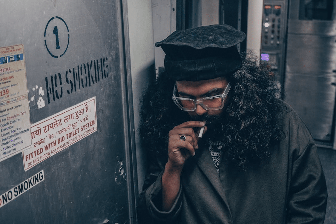 A man smoking a cigarette