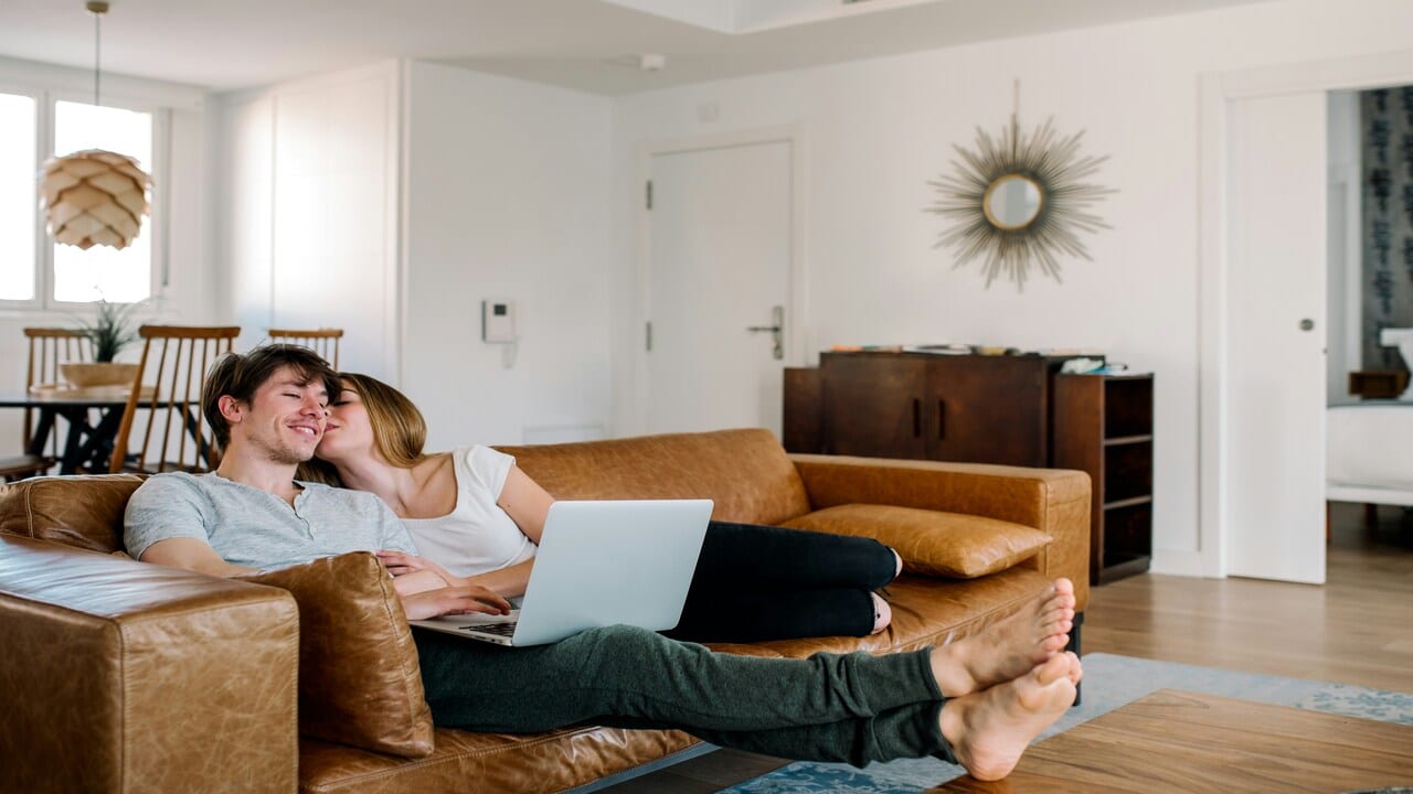 A couple relaxing on the couch