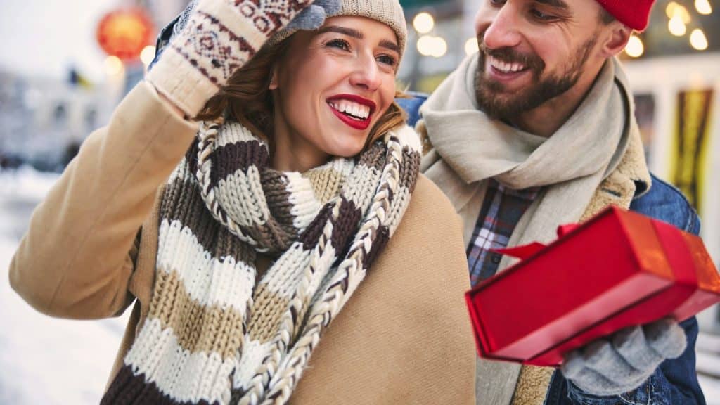 A man giving a woman a gift.
