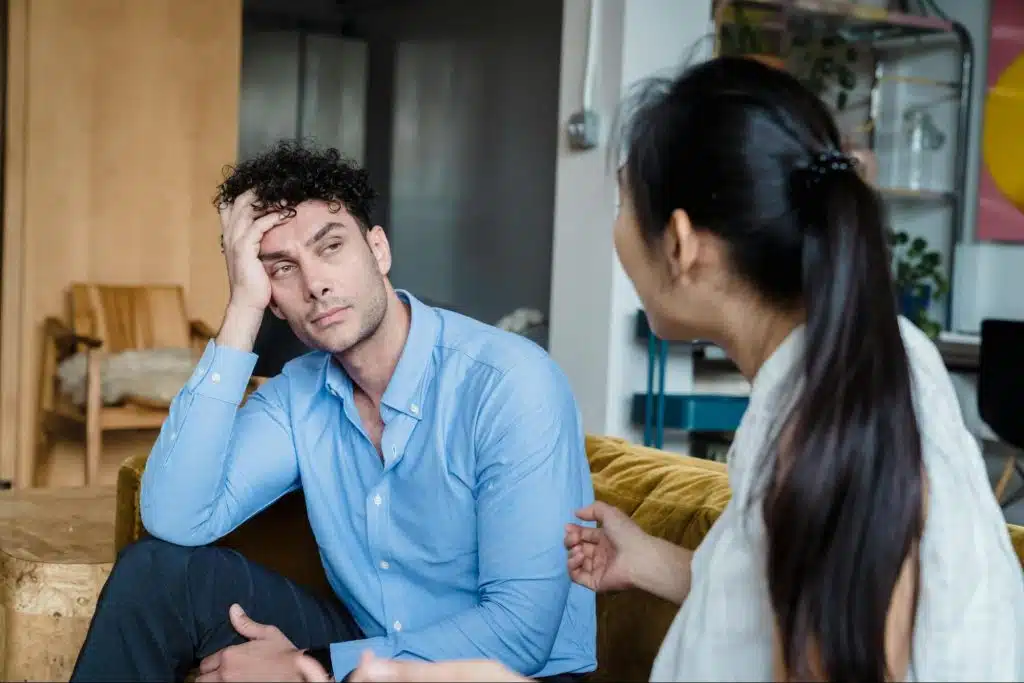 A man listening to woman