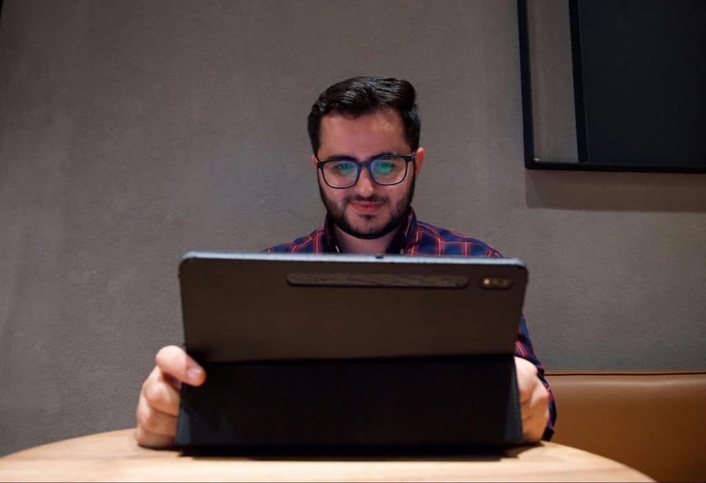 A man looking at the laptop