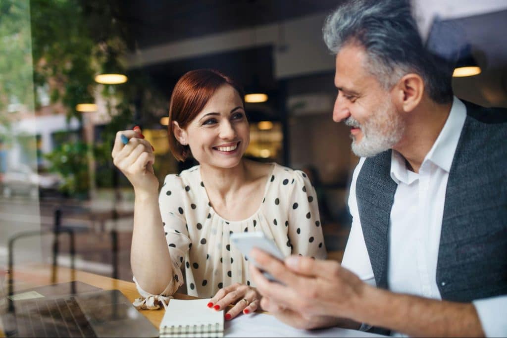 A man and woman smiling at each other