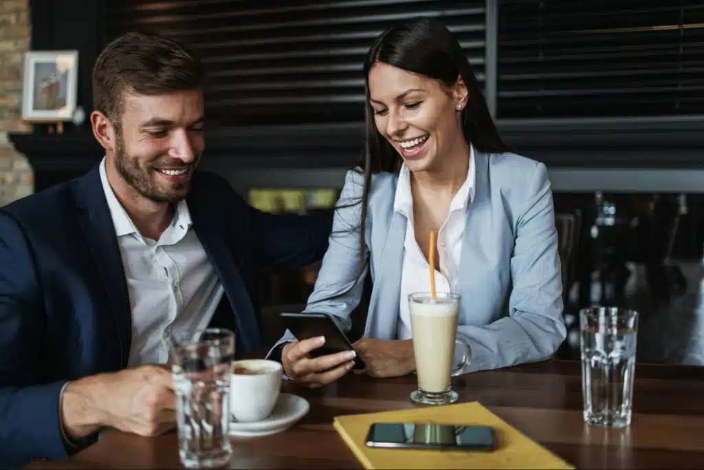 A woman showing something to a man