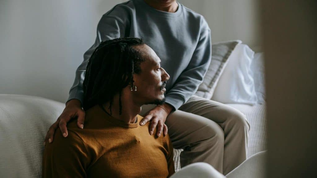 A woman listening to her upset boyfriend