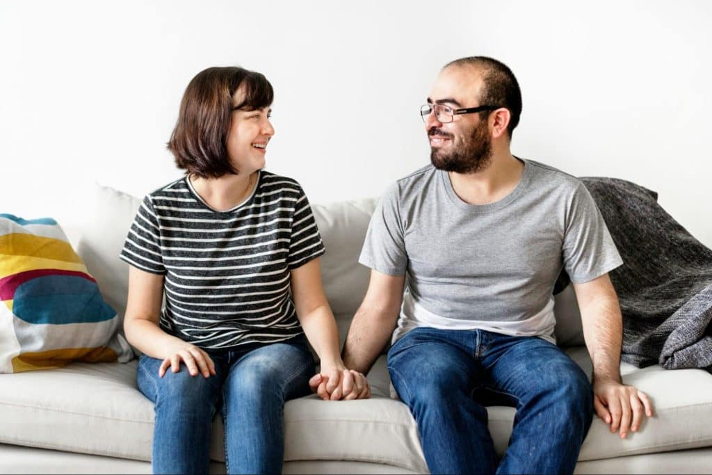 A man and woman looking at each other