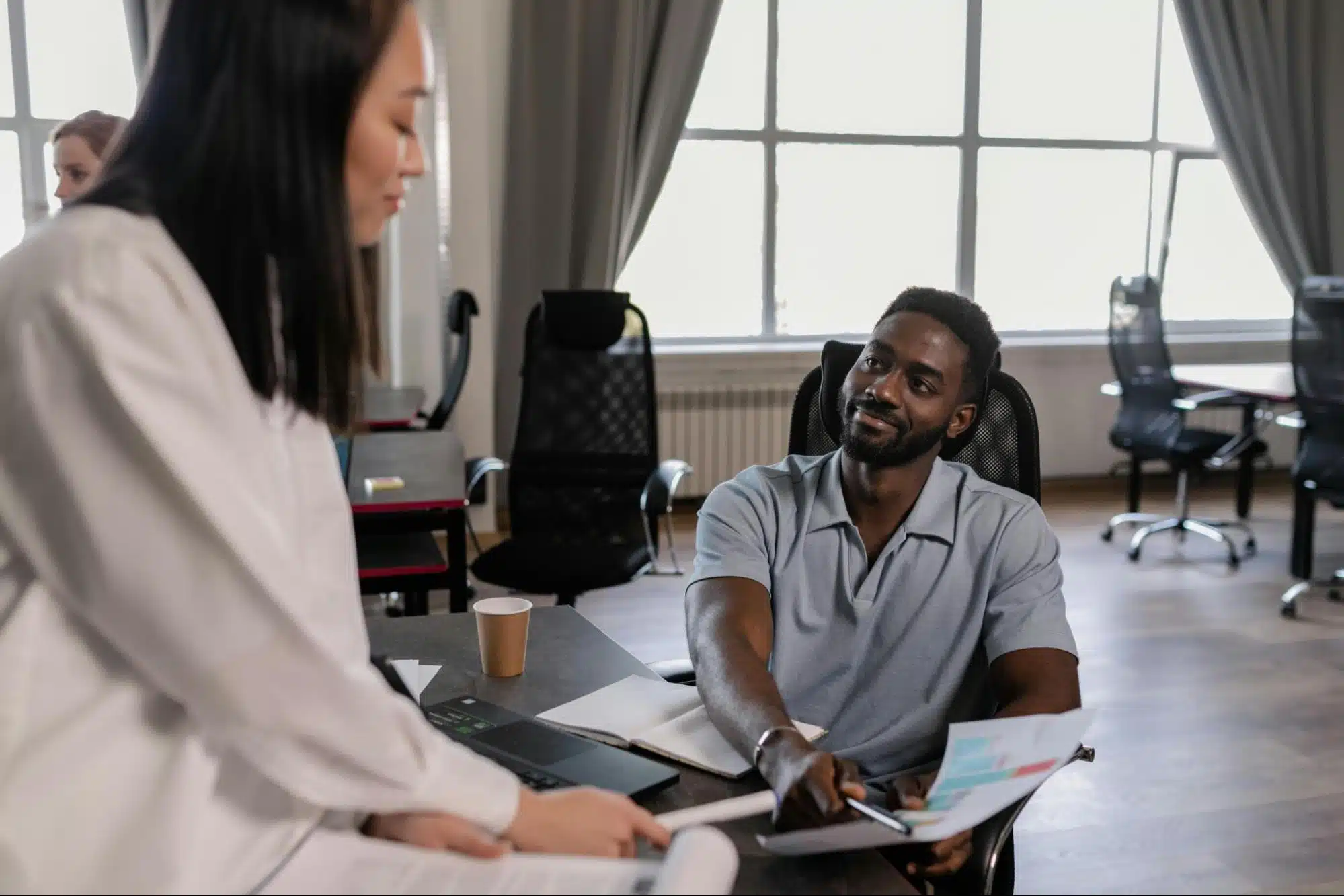 A man smiling at the woman