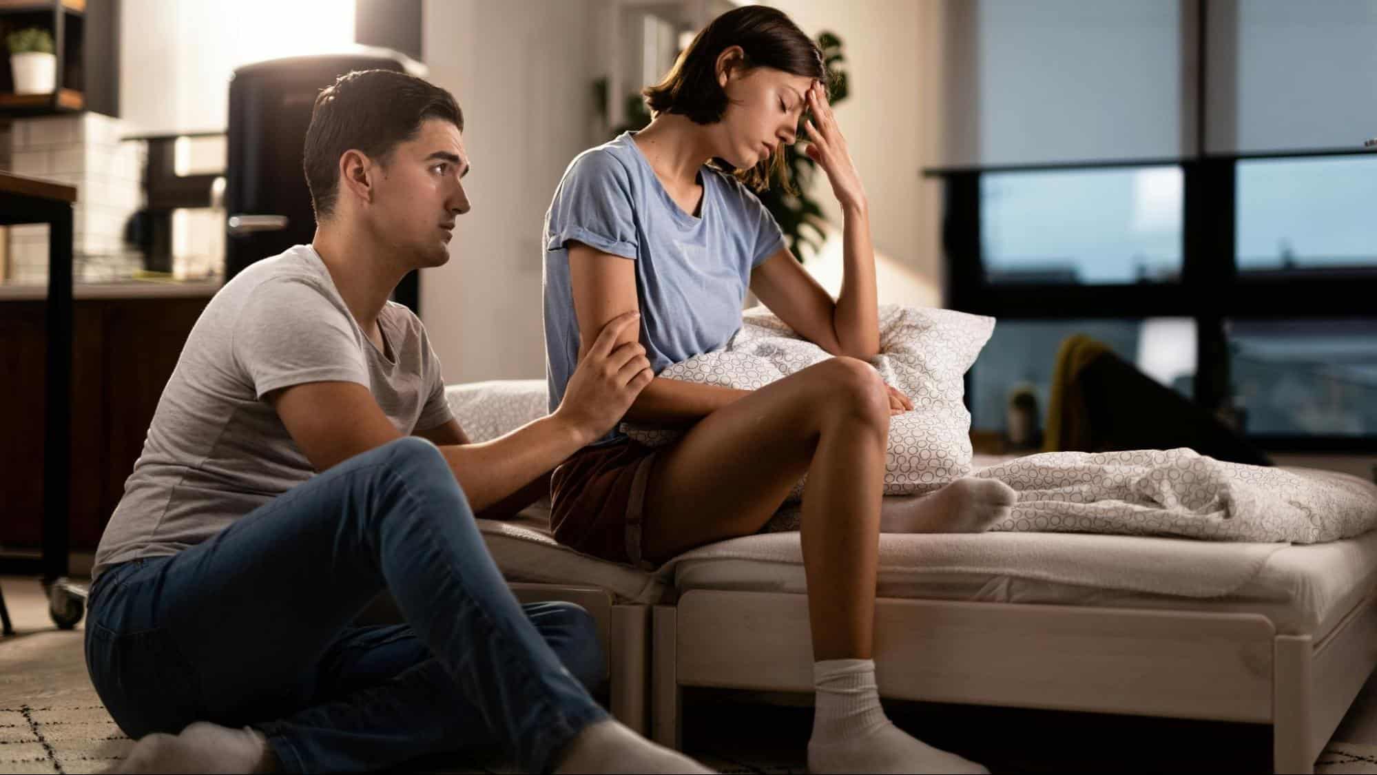 A man apologizing to woman