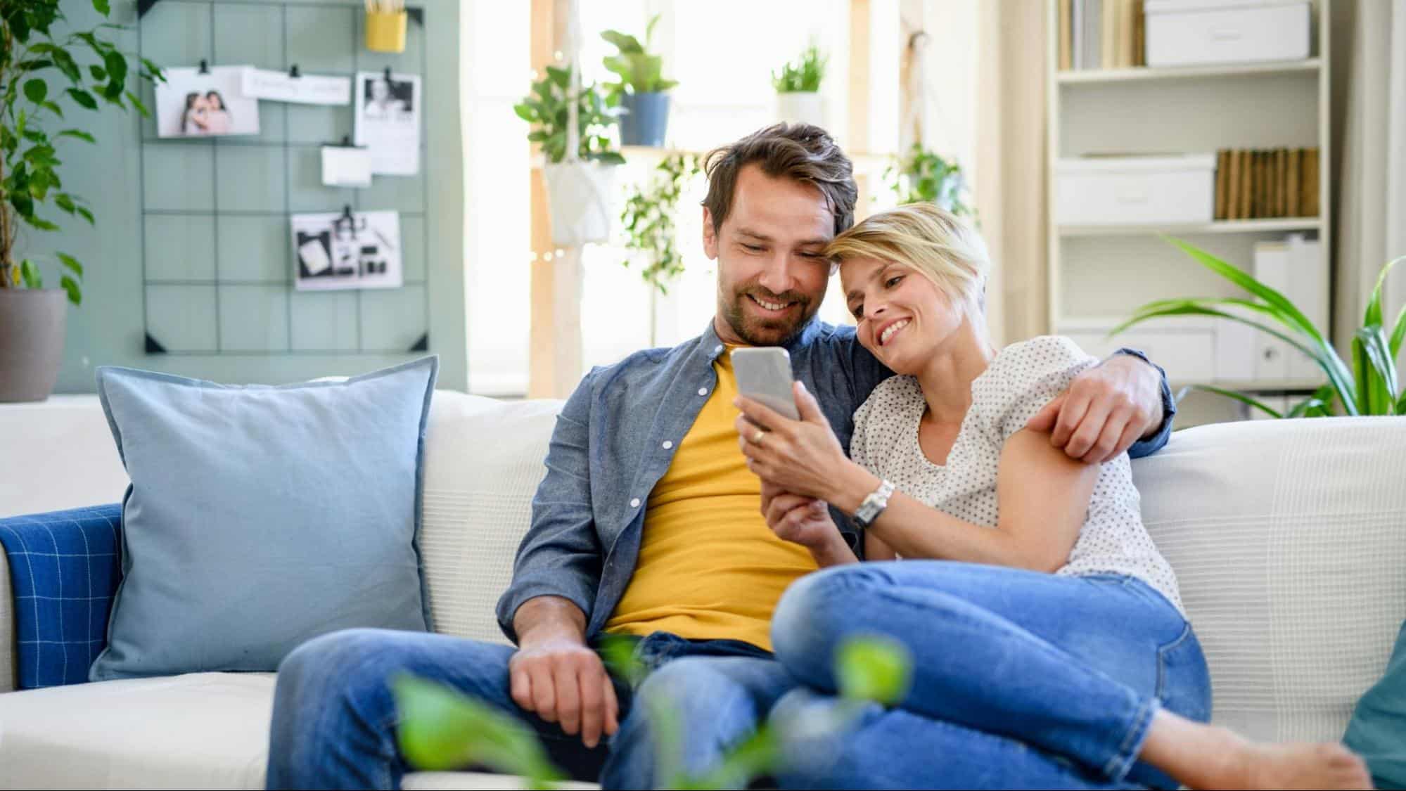A woman showing something to a man