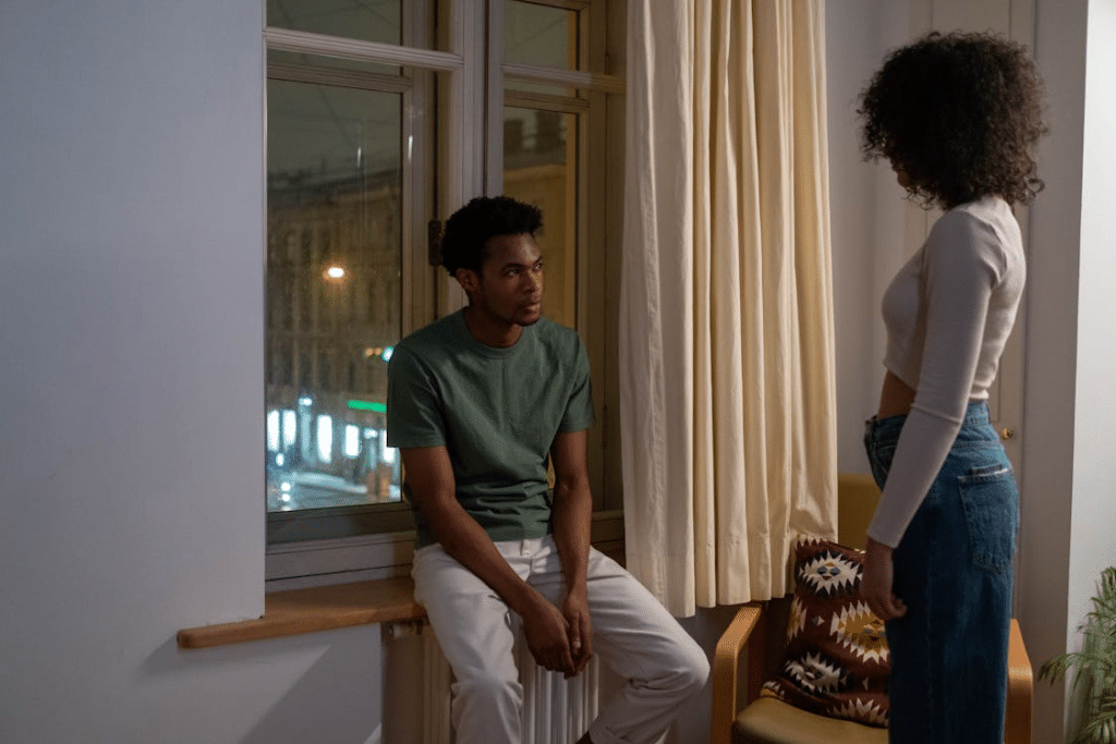 A man and a woman inside an apartment