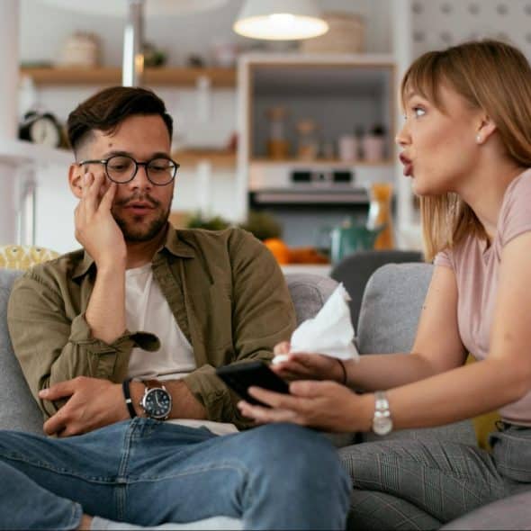 A man avoiding a yelling woman