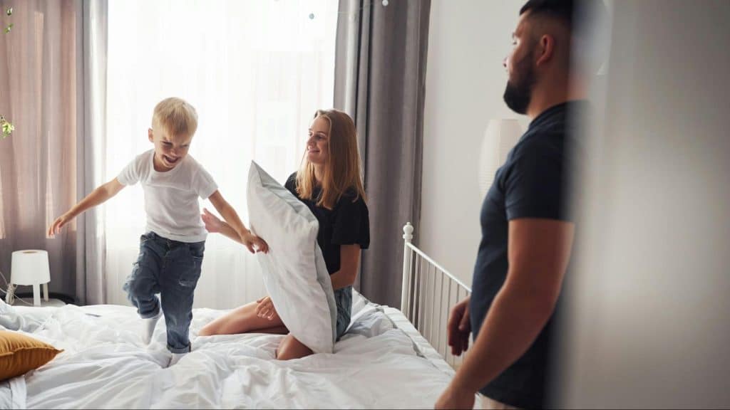 A man looking at the woman and his son