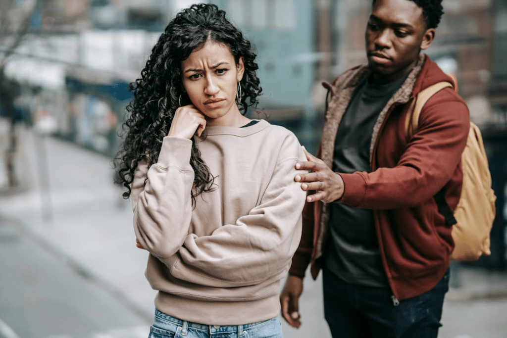 A woman ignoring a man in the street