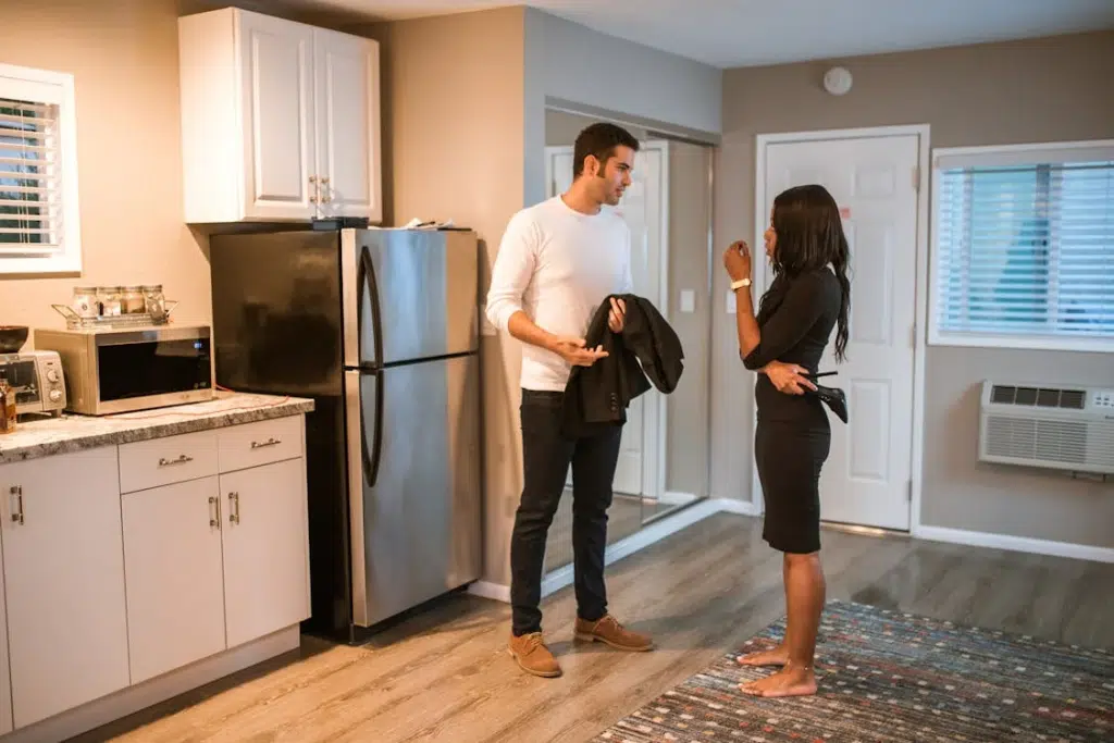 A man and woman in a kitchen