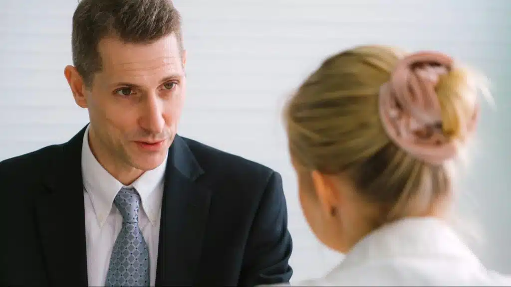 A man talking to woman