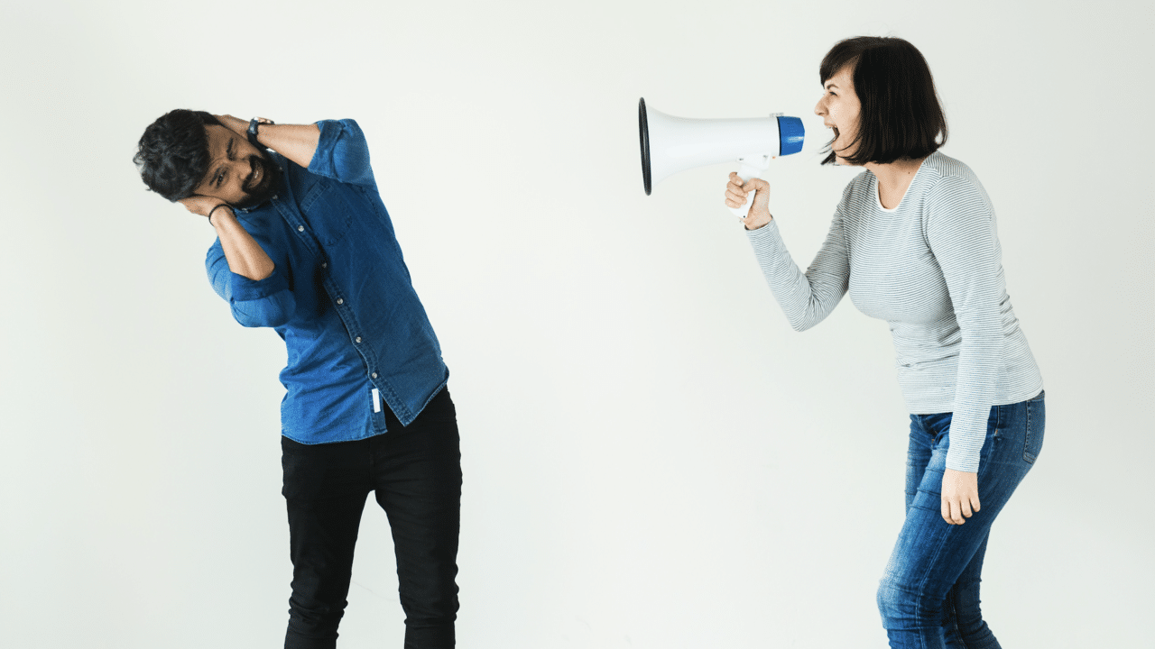 A woman shouting through a megaphone