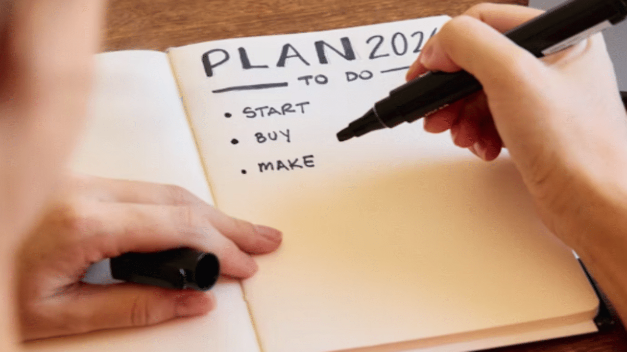 A woman listing down her plans