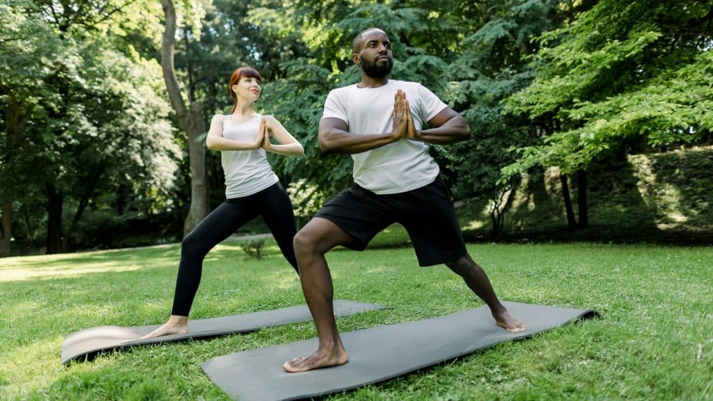 A couple doing yoga.