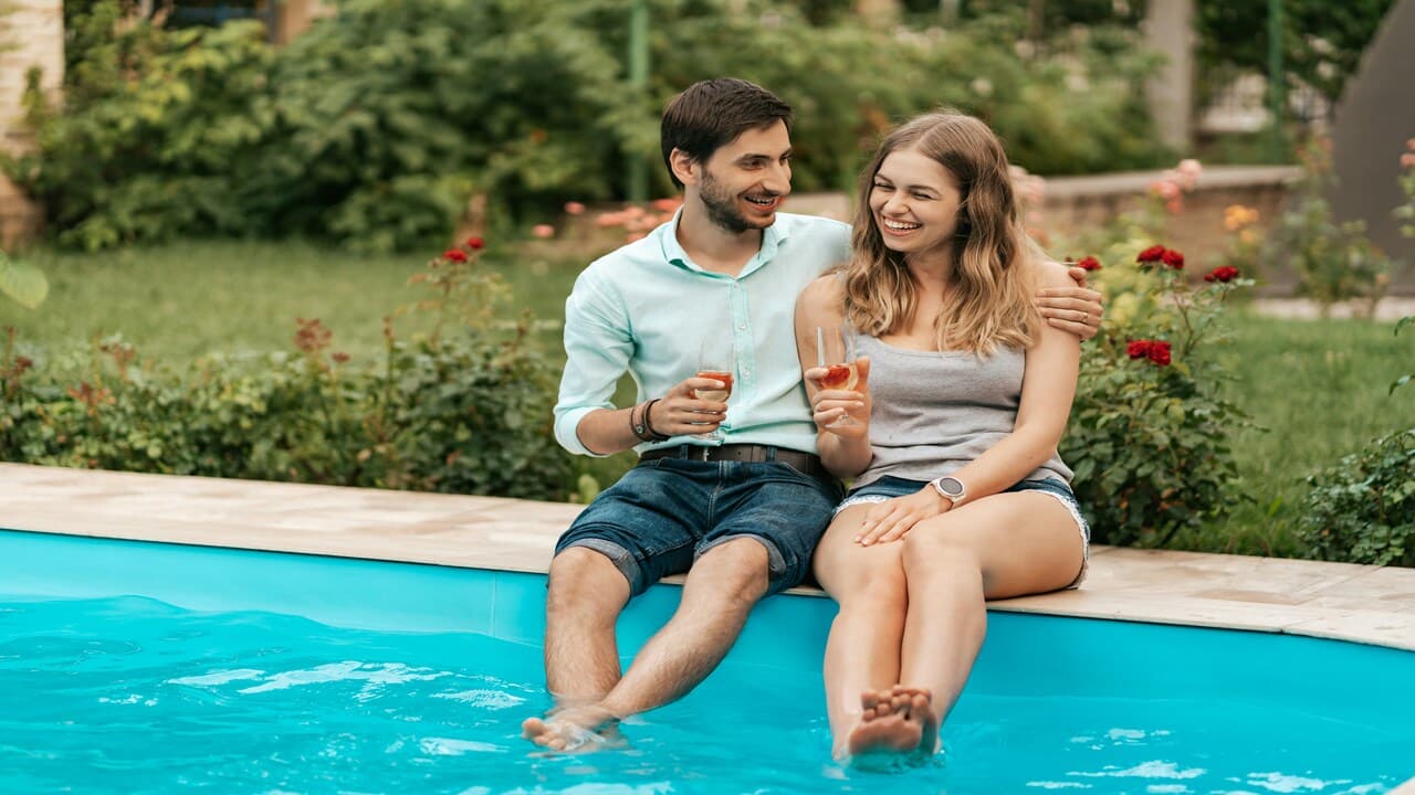 A couple wading in the pool
