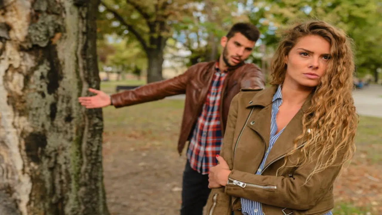 A couple fighting in the park