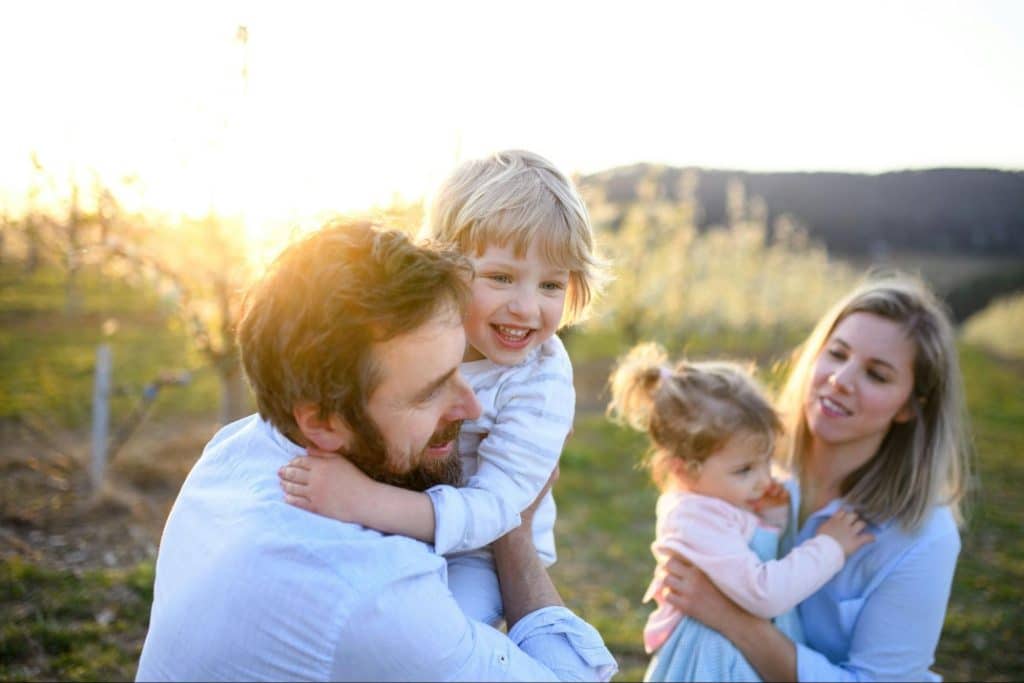 A man and woman with their children