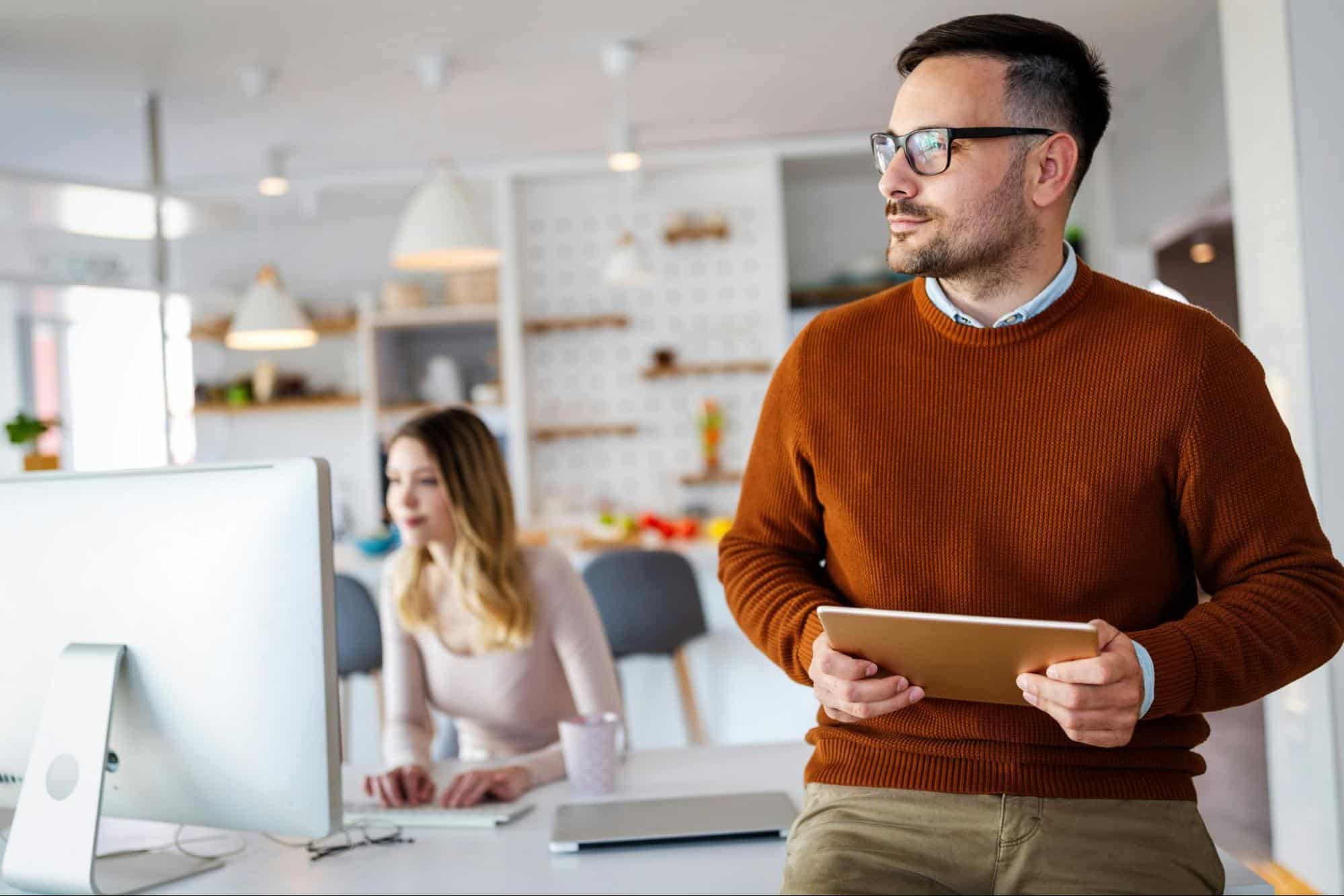 A man and woman busy working 