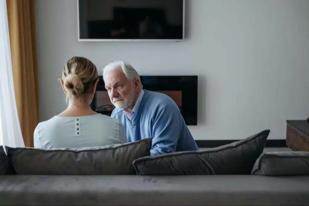 A man and woman talking 