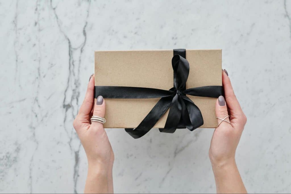 A person holding a box 