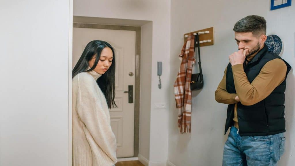 A couple looking upset by the entryway