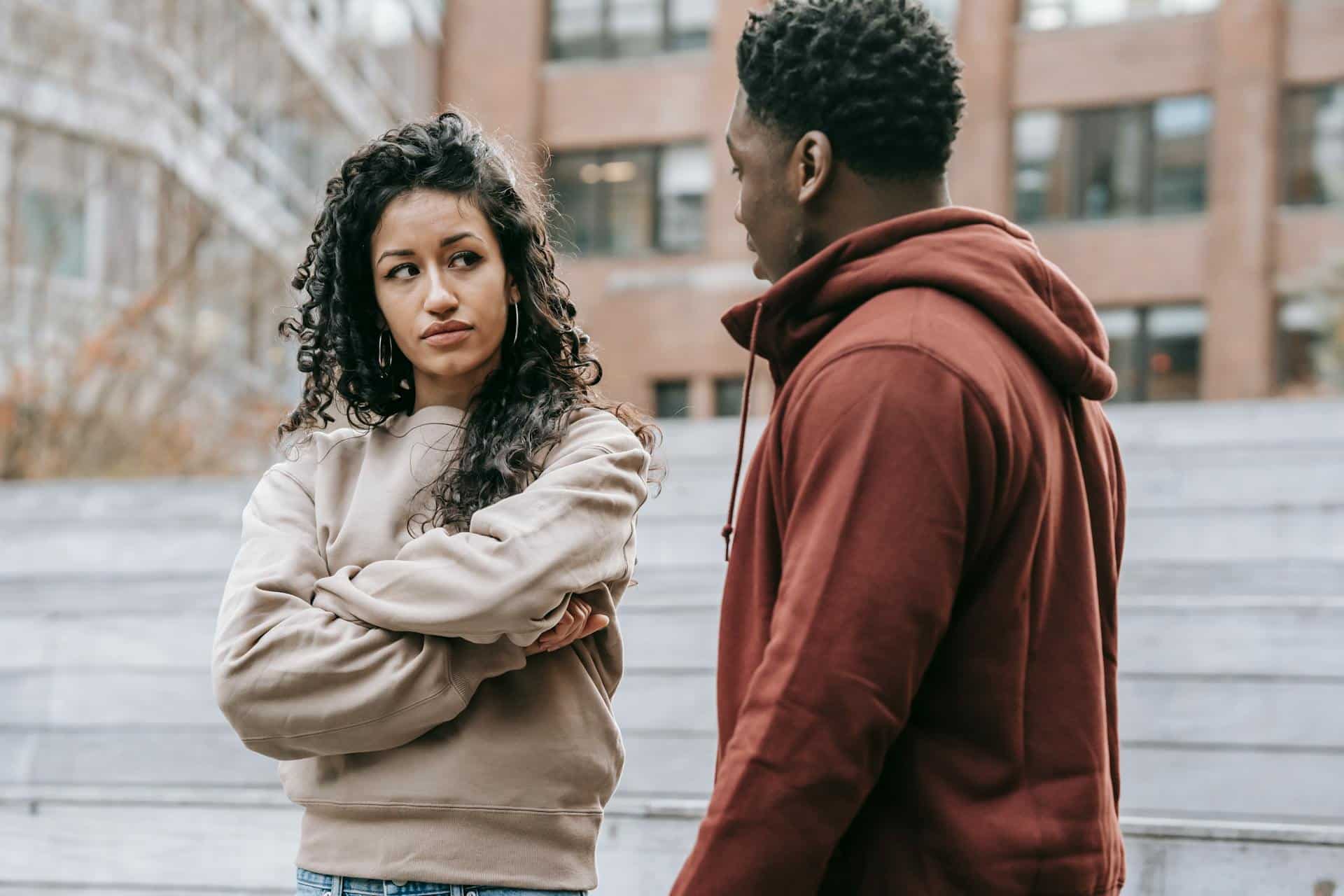 A couple arguing on the street.