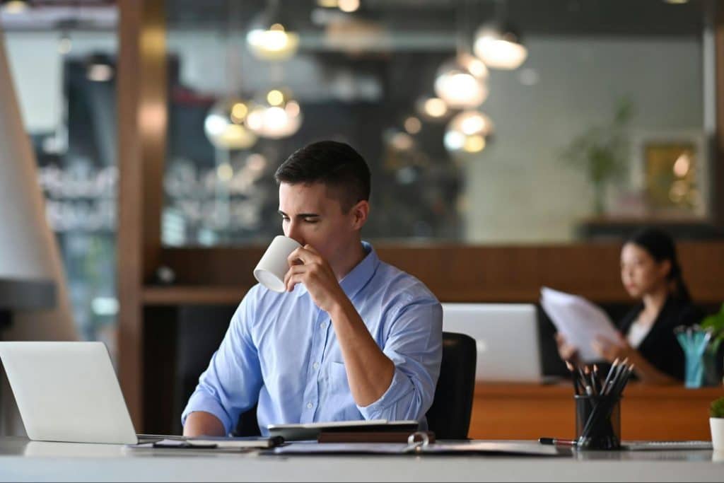 A man drinking a coffee