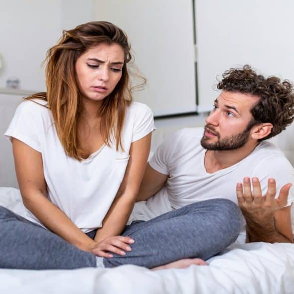 A couple fighting in the bedroom
