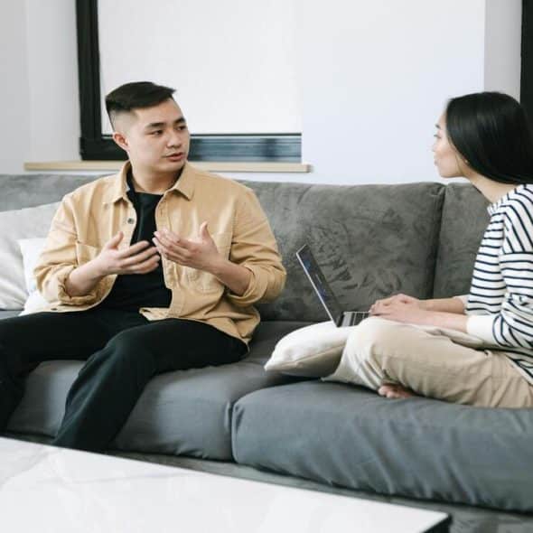 A woman listening to a man